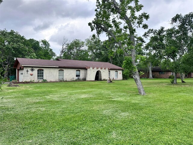 597 County Road 605, Angleton, TX 77515 - single story home with an attached garage and a front lawn
