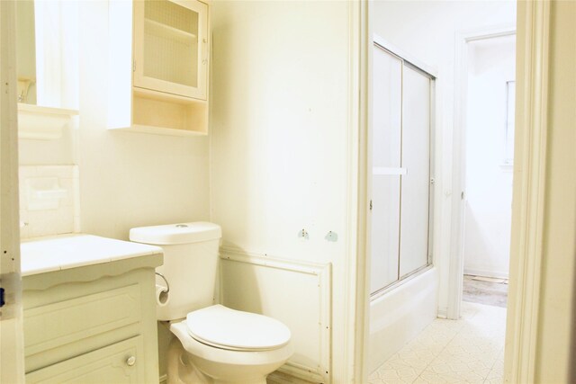 597 County Road 605, Angleton, TX 77515 - bathroom with bath / shower combo with glass door, toilet, and vanity
