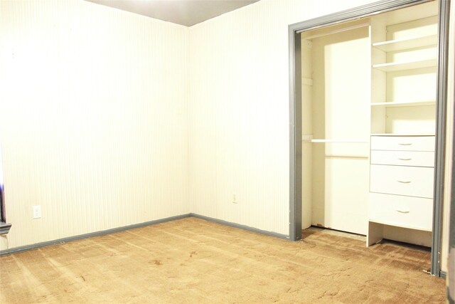 597 County Road 605, Angleton, TX 77515 - unfurnished bedroom featuring light carpet