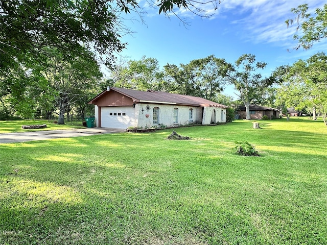 597 County Road 605, Angleton, TX 77515 - single story home featuring concrete driveway, a front lawn, and a garage