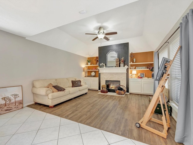 2806 Village Dl, Houston, TX 77059 - living room with ceiling fan, tile patterned floors, a fireplace with flush hearth, and vaulted ceiling