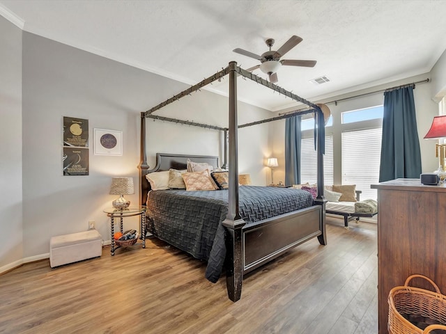 2806 Village Dl, Houston, TX 77059 - bedroom with ornamental molding, wood finished floors, ceiling fan, and baseboards