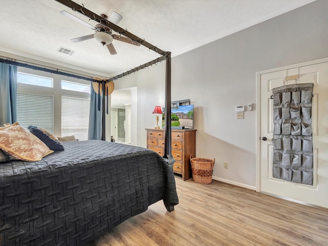 2806 Village Dl, Houston, TX 77059 - bedroom featuring light wood finished floors, baseboards, ceiling fan, and ornamental molding