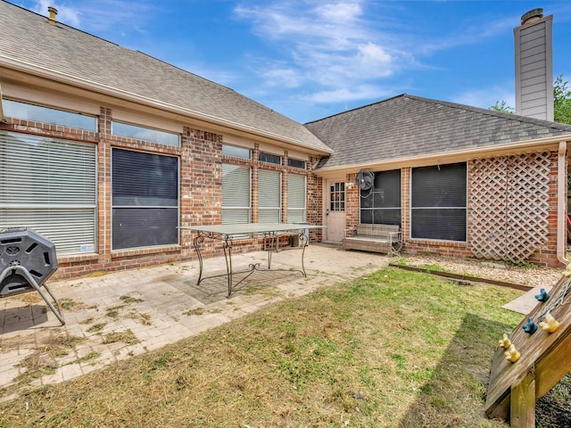 2806 Village Dl, Houston, TX 77059 - back of house with brick siding, a patio, a chimney, and a shingled roof