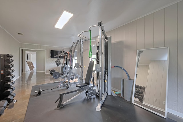 workout room featuring visible vents and ornamental molding