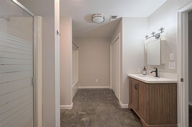 bathroom featuring concrete flooring, vanity, visible vents, and baseboards