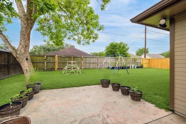 view of patio featuring a fenced backyard and a playground