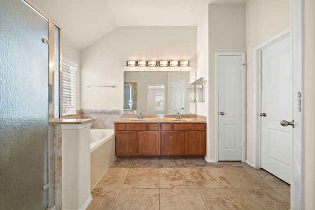 7234 Rambling Tree Ln, Richmond, TX 77407 - bathroom with a shower stall, vaulted ceiling, a sink, a bath, and double vanity