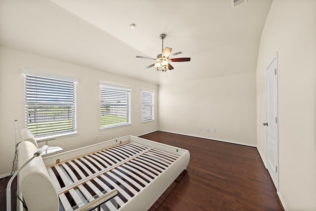 7234 Rambling Tree Ln, Richmond, TX 77407 - bedroom featuring wood finished floors, ceiling fan, baseboards, lofted ceiling, and visible vents