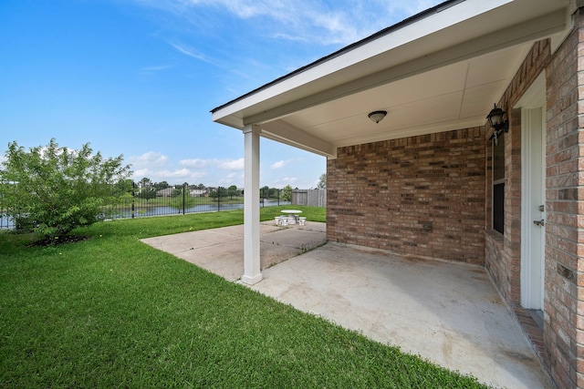 7234 Rambling Tree Ln, Richmond, TX 77407 - view of patio / terrace featuring fence and a water view