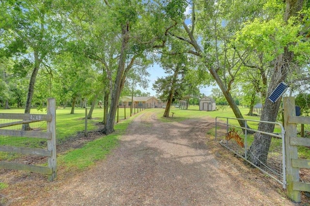 4249 County Road 571, West Columbia, TX 77486 - view of road featuring driveway and a gated entry