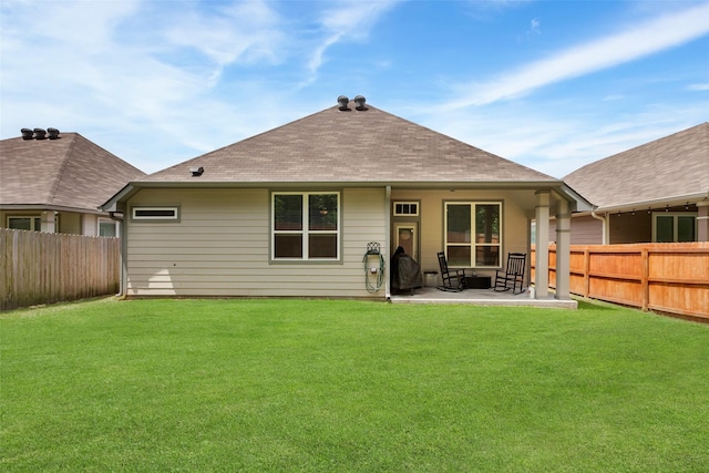 108 Alessandra Way, Huntsville, TX 77320 - back of property with a fenced backyard, a patio area, and a yard