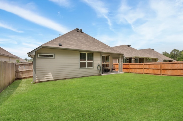 108 Alessandra Way, Huntsville, TX 77320 - back of house featuring a lawn, a patio, and a fenced backyard