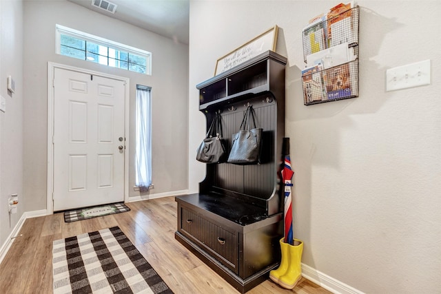 108 Alessandra Way, Huntsville, TX 77320 - entrance foyer with wood finished floors, visible vents, and baseboards