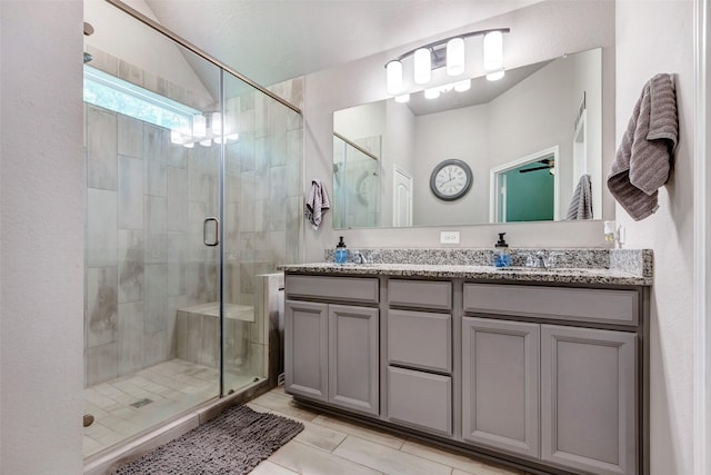 108 Alessandra Way, Huntsville, TX 77320 - bathroom featuring double vanity, a shower stall, tile patterned flooring, and a sink