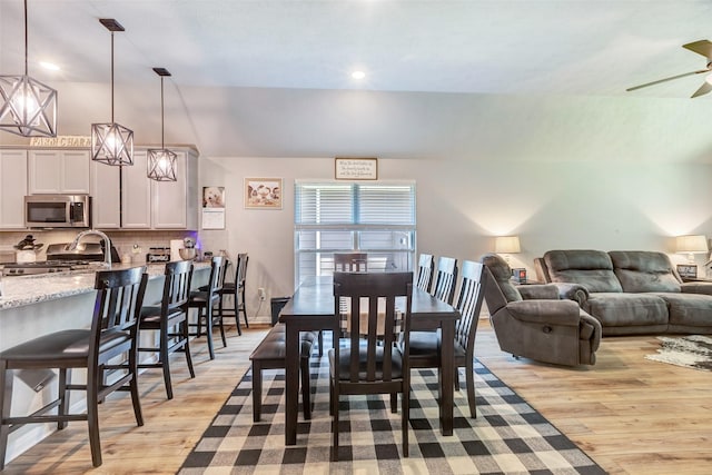 108 Alessandra Way, Huntsville, TX 77320 - dining area featuring vaulted ceiling, light wood finished floors, and a ceiling fan