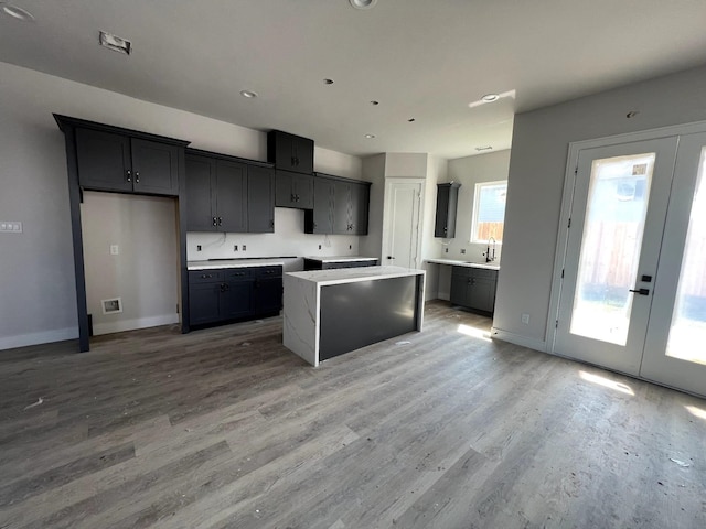 6405 Sidney St, Houston, TX 77021 - kitchen featuring baseboards, french doors, and light wood-style flooring
