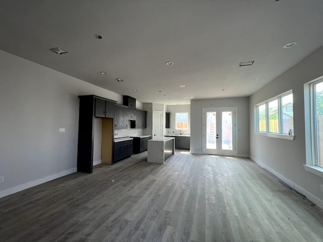 6405 Sidney St, Houston, TX 77021 - unfurnished living room with baseboards, wood finished floors, and recessed lighting