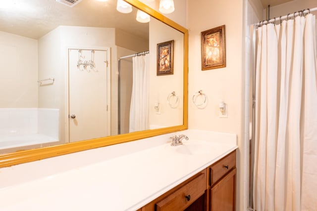 bathroom with visible vents, vanity, and a shower with curtain