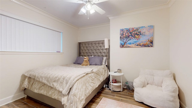 bedroom featuring ceiling fan, baseboards, wood finished floors, and ornamental molding