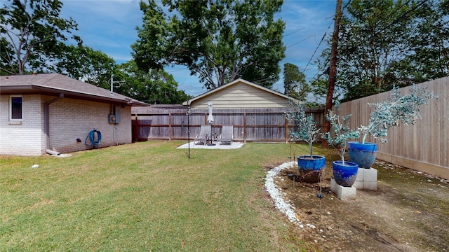 view of yard with a fenced backyard