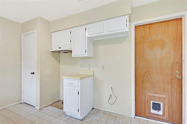 1419 Avenue Ave E, Danbury, TX 77534 - laundry room with baseboards and light tile patterned flooring