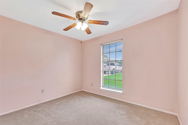 1419 Avenue Ave E, Danbury, TX 77534 - unfurnished room with light colored carpet, baseboards, and ceiling fan