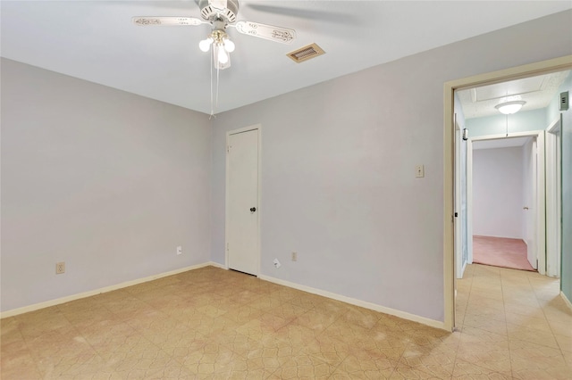 1419 Avenue Ave E, Danbury, TX 77534 - spare room with visible vents, attic access, baseboards, and ceiling fan