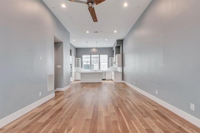 unfurnished living room featuring recessed lighting, ceiling fan, light wood finished floors, baseboards, and visible vents