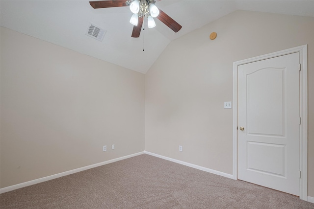 carpeted spare room featuring baseboards, ceiling fan, lofted ceiling, and visible vents