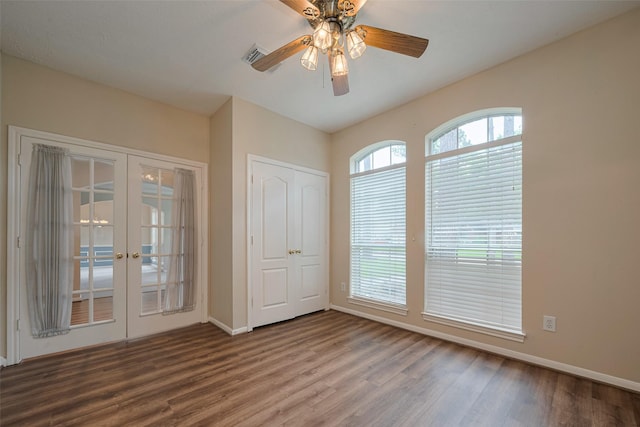 interior space featuring visible vents, wood finished floors, baseboards, french doors, and a ceiling fan