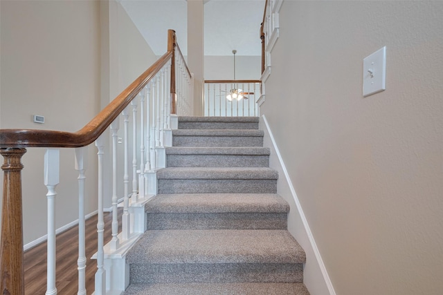 stairs with wood finished floors