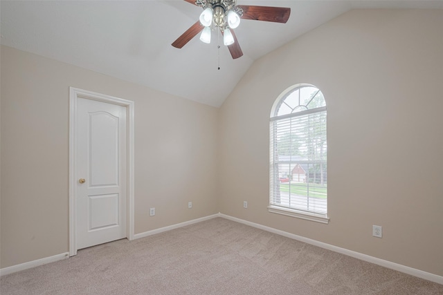 unfurnished room with a ceiling fan, a wealth of natural light, and lofted ceiling