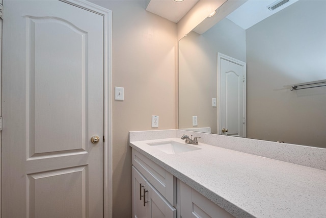 bathroom with visible vents and vanity