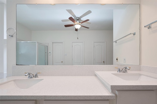 full bathroom with vanity, ceiling fan, and a stall shower