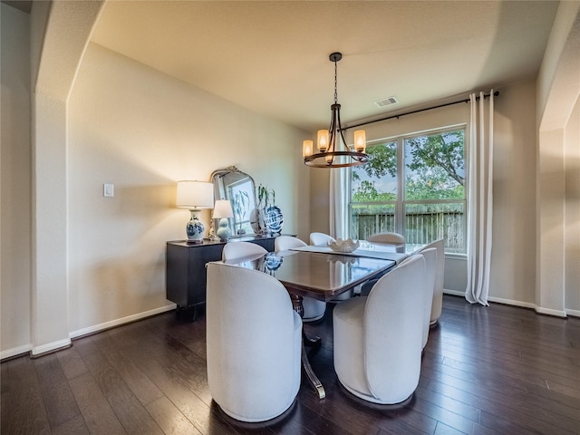 2560 Wild Oak Forest Ln, Seabrook, TX 77586 - dining room with an inviting chandelier, visible vents, dark wood-style flooring, and baseboards