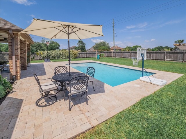 2560 Wild Oak Forest Ln, Seabrook, TX 77586 - view of swimming pool with a yard, a fenced in pool, and a fenced backyard