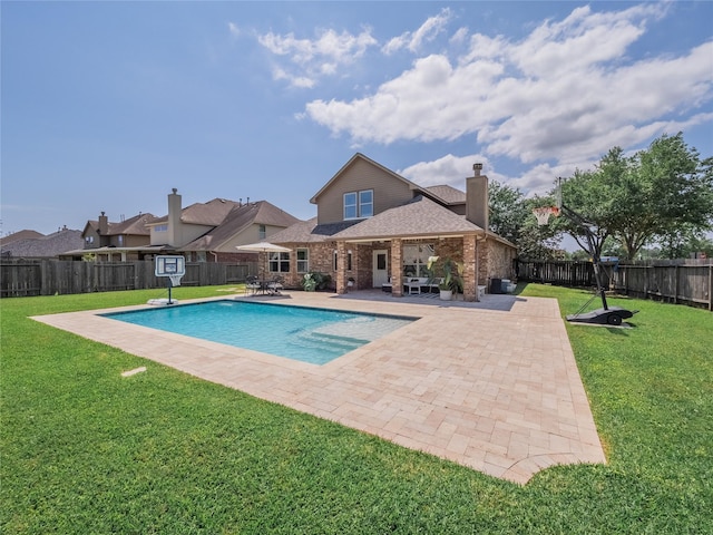 2560 Wild Oak Forest Ln, Seabrook, TX 77586 - view of swimming pool with a yard, a patio, a fenced in pool, and a fenced backyard