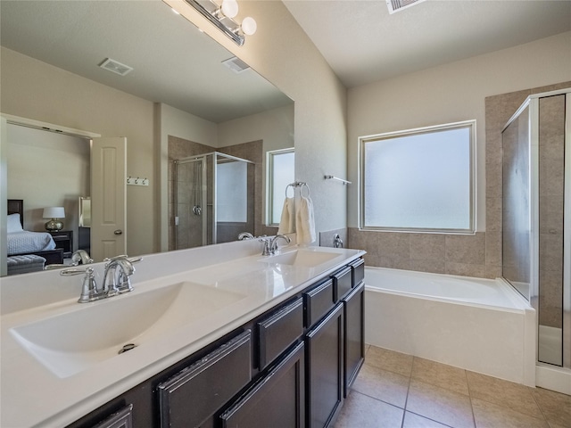 2560 Wild Oak Forest Ln, Seabrook, TX 77586 - ensuite bathroom featuring ensuite bathroom, visible vents, a shower stall, and a sink