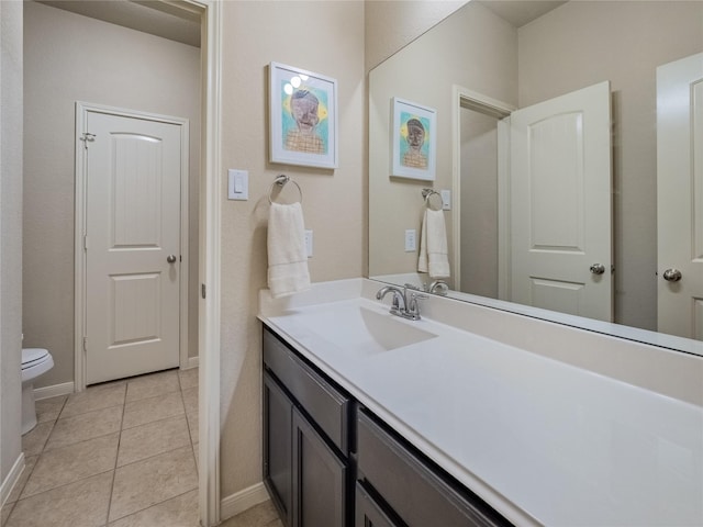 2560 Wild Oak Forest Ln, Seabrook, TX 77586 - bathroom with vanity, toilet, baseboards, and tile patterned floors