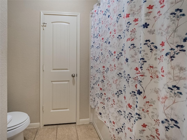 2560 Wild Oak Forest Ln, Seabrook, TX 77586 - bathroom featuring tile patterned flooring, toilet, and baseboards