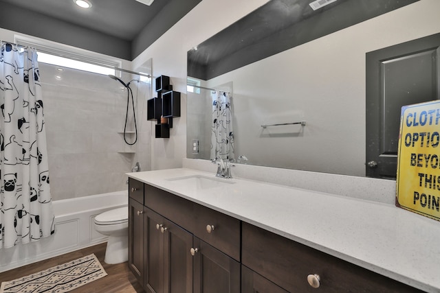 bathroom with toilet, shower / bath combination with curtain, wood finished floors, and vanity