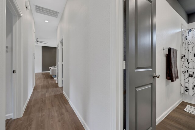 hallway with baseboards, dark wood-type flooring, recessed lighting, and visible vents