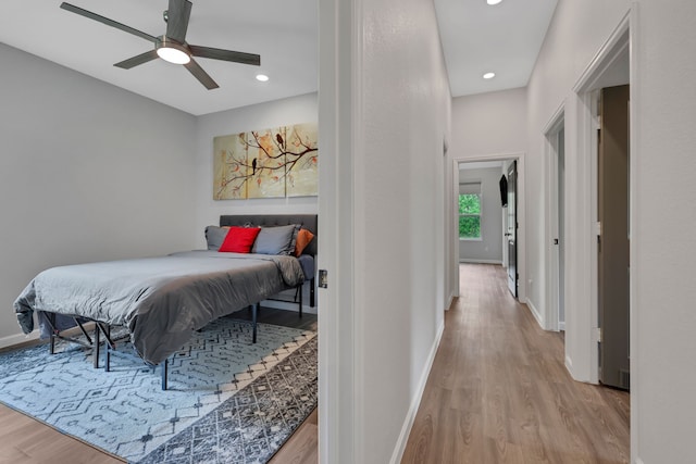 bedroom with recessed lighting, baseboards, ceiling fan, and light wood-style floors