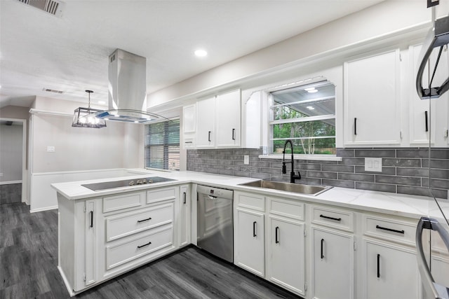 kitchen with island range hood, a sink, black appliances, a peninsula, and white cabinetry