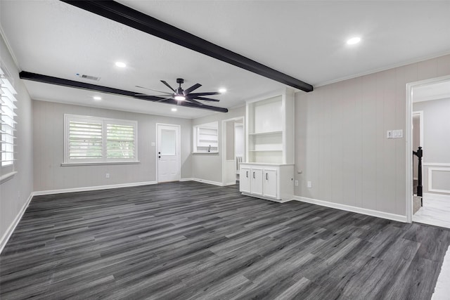 unfurnished living room featuring visible vents, dark wood-type flooring, beam ceiling, baseboards, and ceiling fan