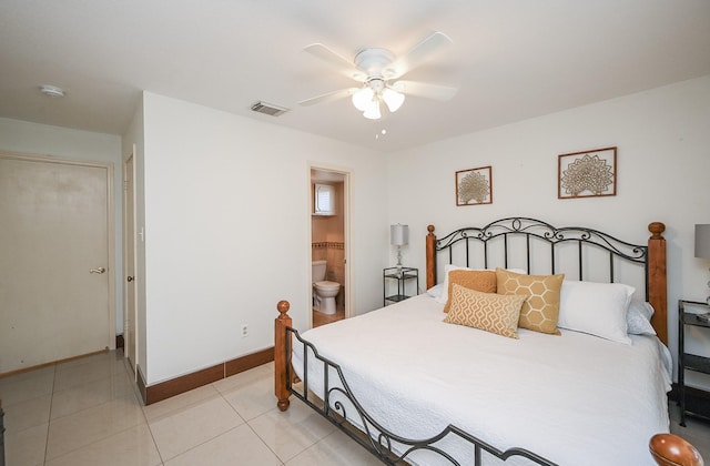 bedroom with visible vents, light tile patterned flooring, baseboards, ceiling fan, and ensuite bathroom