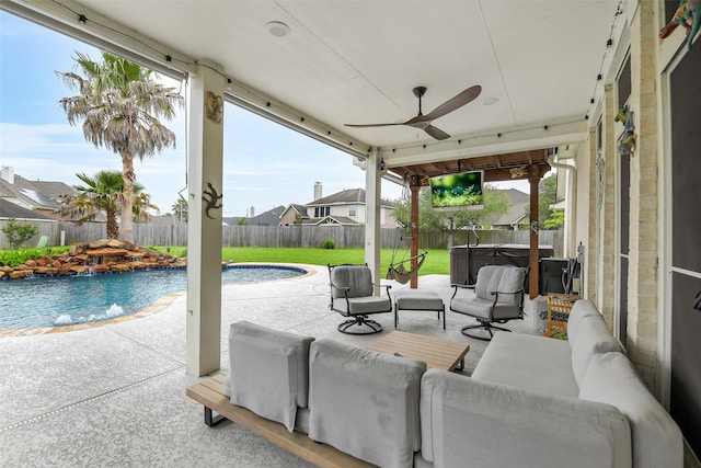 view of patio / terrace with a fenced in pool, a fenced backyard, a ceiling fan, a hot tub, and an outdoor living space