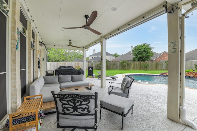 view of patio featuring a fenced in pool, a fenced backyard, a grill, outdoor lounge area, and a ceiling fan