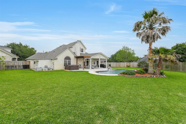 back of property with a lawn, a fenced backyard, a hot tub, a patio, and a fenced in pool